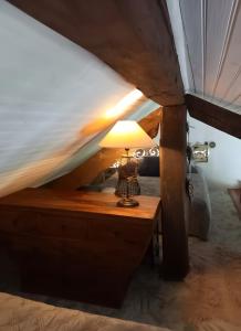 Katil atau katil-katil dalam bilik di Maisonnette Cocooning en Sologne