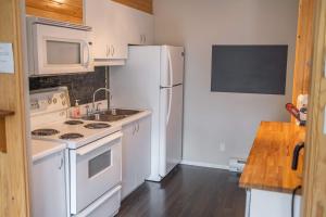 Kuchyň nebo kuchyňský kout v ubytování Condo at Massif du Sud - Condo Thibault 117