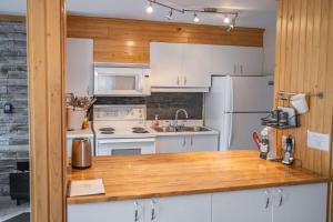 Kuchyň nebo kuchyňský kout v ubytování Condo at Massif du Sud - Condo Thibault 117