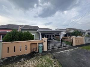 a house with a fence in front of it at Ateh's Homestay KLIA1 in Sepang