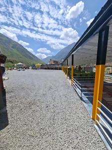 a view of a train station with mountains in the background at Eagle Resort Hotel and Restaurant in Naran +40 photos