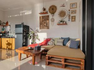 a living room with a couch and a table at Tranquil 2BR Villa with Pool in Kerobokan
