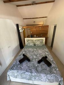 Ένα ή περισσότερα κρεβάτια σε δωμάτιο στο Chambre d'Hôtes Chez Tania et Benoit