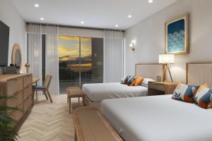 Postel nebo postele na pokoji v ubytování Sapphire Sands by Bay Gardens Resorts + 19 fotografií