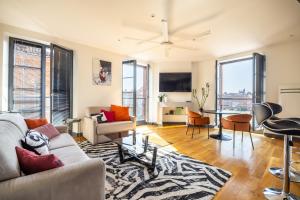 a living room with a couch and a table at Capitole Horizon in Toulouse