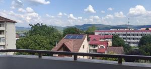 a building with a roof with solar panels on it at Apartament 2 camere in Râmnicu Vâlcea