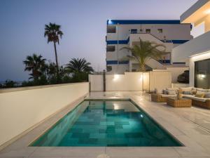 a swimming pool in the backyard of a house at Las Burras Ocean Front Views in San Bartolomé