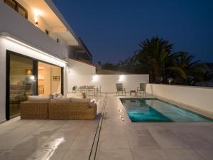 a villa with a swimming pool and a patio at Las Burras Ocean Front Views in San Agustin +66 photos