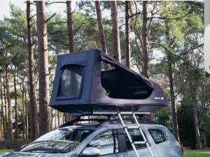 a car with a tv on top of it at Tent box go in Oystermouth