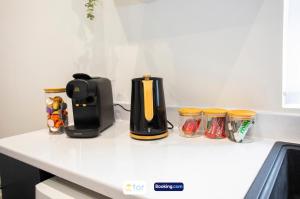 a coffee maker on a counter in a kitchen at Caxton House Newport by The One Retreats in Newport