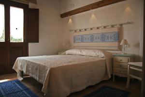 Voodi või voodid majutusasutuse Agriturismo Fioredda toas