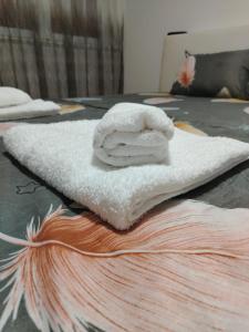 a white towel sitting on top of a table at Apartman Zdravković in Leskovac