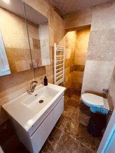 a bathroom with a white sink and a toilet at Cherrykonak cappadocia in Uchisar