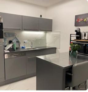 a kitchen with a sink and a counter top at Urlaub in Enzklößterle in Enzklösterle