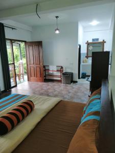 a bedroom with a large bed in a room at Super View in Ella