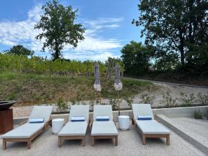 a group of chairs and a table and four chairs at Vila Solini in Kozana