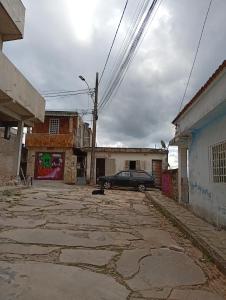 a car parked in the middle of a street at Casa Pôr do Sol in São Thomé das Letras