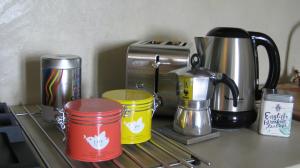Coffee and tea making facilities at Holiday Home Cannubi in Barolo