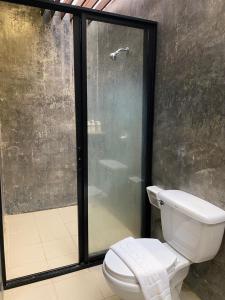 a bathroom with a toilet and a shower at baan in kan homestay&cafe kanchanaburi city in Kanchanaburi