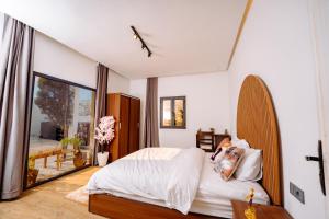 En eller flere senge i et værelse på Villa Nour Mogador