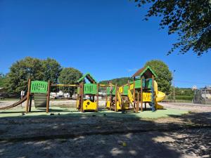 a playground with a bunch of play equipment in a park at O'bocolecha in Orges