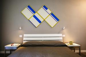 Postel nebo postele na pokoji v ubytování B&B WarmUp Grosseto - Parcheggio incluso nella corte interna