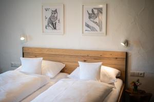two beds sitting next to each other in a bedroom at Alma Hotel Oberstdorf in Oberstdorf