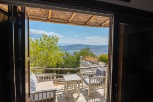 a view from the door of a house with a balcony at Villa Stagiates in Stagiates