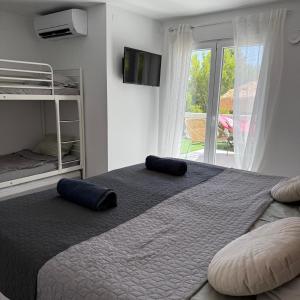a bedroom with a large bed and a window at Casa Montebello in Cautivador