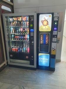 an energy drink vending machine next to a soda machine at Barbara 12 in Ustroń
