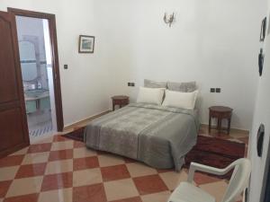 Ένα ή περισσότερα κρεβάτια σε δωμάτιο στο Riad JOUHARA