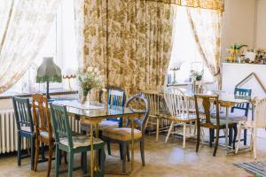 a dining room with a table and chairs at Cosy apartment in Padise in Padise