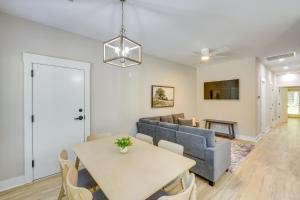 a living room with a table and a couch at Near 17 Springs Sports Complex Millbrook Duplex! in Millbrook