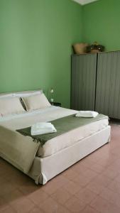 Ένα ή περισσότερα κρεβάτια σε δωμάτιο στο Le case di Giù