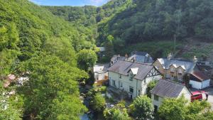 an aerial view of a small village in the mountains at River Cottage in stunning location in Countisbury