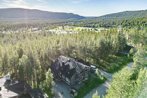 an aerial view of a house in the woods at Villa Aatu Levi Ski-in Ski-out in Levi