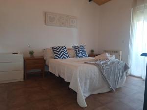 En eller flere senge i et værelse på El cerro