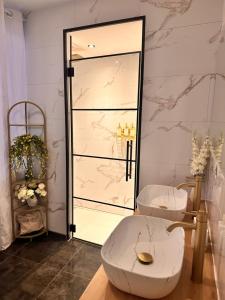 a bathroom with a toilet and a glass shower at Secret Rock - Jaccuzi privé in La-Roche-en-Ardenne +26 photos