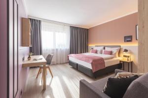 Ένα ή περισσότερα κρεβάτια σε δωμάτιο στο Garner Hotel Berlin - Ku'Damm by IHG