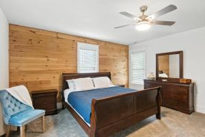 a bedroom with a bed and a ceiling fan at Historic Elegance in the Heart of Elizabeth City home in Elizabeth City