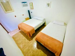 Ένα ή περισσότερα κρεβάτια σε δωμάτιο στο Nomads Family Rooms, Fortuna Town