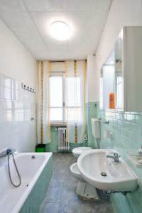 Koupelna v ubytování R & R Apartment