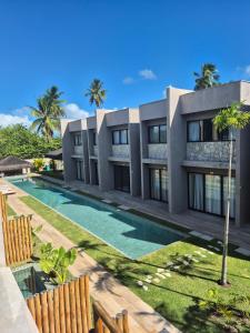 an image of a villa with a swimming pool at Casa Guaimbê com Rooftop e piscina privativa in São Miguel dos Milagres