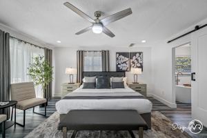 a bedroom with a bed and a ceiling fan at Luxury Retreat: Pool Games Basketball More in Largo +46 photos