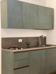 a kitchen with a sink and a counter top at PHI-Lampara in Santa Flavia
