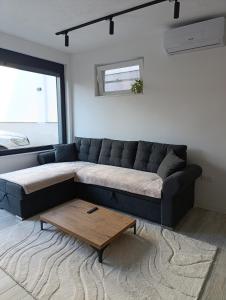 Et opholdsområde på GRBAVICA COZY APARTMENT - free parking