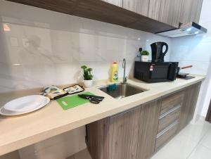 Kuchyň nebo kuchyňský kout v ubytování Angsana Mall 10min-Garden View-Studio-C125