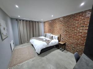 Ένα ή περισσότερα κρεβάτια σε δωμάτιο στο The Goose Guesthouse