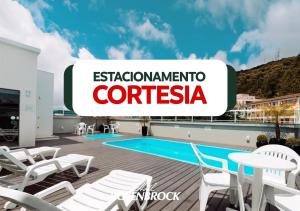 apartment on the roof of a building with a swimming pool at Hotel Rosenbrock in Balneário Camboriú