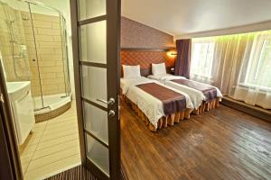 Кровать или кровати в номере Apart Hotel Kvartira 1